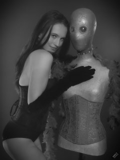 2019-09-21 Kristine Gold - in tightly-laced black underbust corset worn over black Miraclesuit strapless one-piece bodyshaper