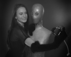 2019-09-21 Kristine Gold - in tightly-laced black underbust corset worn over black Miraclesuit strapless one-piece bodyshaper