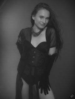 2019-09-21 Kristine Gold - in tightly-laced black underbust corset worn over black Miraclesuit strapless one-piece bodyshaper