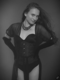 2019-09-21 Kristine Gold - in tightly-laced black underbust corset worn over black Miraclesuit strapless one-piece bodyshaper