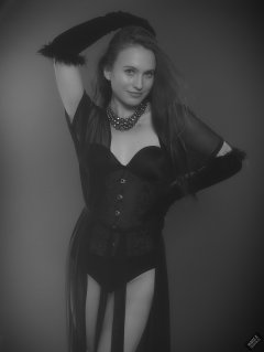 2019-09-21 Kristine Gold - in tightly-laced black underbust corset worn over black Miraclesuit strapless one-piece bodyshaper