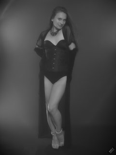 2019-09-21 Kristine Gold - in tightly-laced black underbust corset worn over black Miraclesuit strapless one-piece bodyshaper