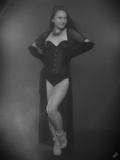 2019-09-21 Kristine Gold - in tightly-laced black underbust corset worn over black Miraclesuit strapless one-piece bodyshaper