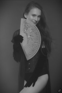 2019-09-21 Kristine Gold - in tightly-laced black underbust corset worn over black Miraclesuit strapless one-piece bodyshaper