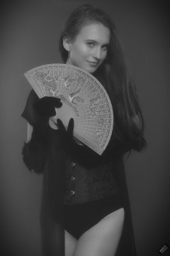 2019-09-21 Kristine Gold - in tightly-laced black underbust corset worn over black Miraclesuit strapless one-piece bodyshaper