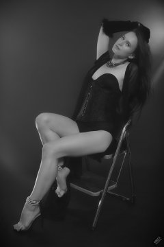 2019-09-21 Kristine Gold - in tightly-laced black underbust corset worn over black Miraclesuit strapless one-piece bodyshaper