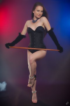 2019-09-21 Kristine Gold - in tightly-laced black underbust corset worn over black Miraclesuit strapless one-piece bodyshaper