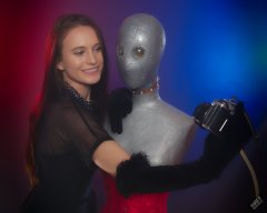 2019-09-21 Kristine Gold - in tightly-laced black underbust corset worn over black Miraclesuit strapless one-piece bodyshaper