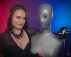 2019-09-21 Kristine Gold - in tightly-laced black underbust corset worn over black Miraclesuit strapless one-piece bodyshaper