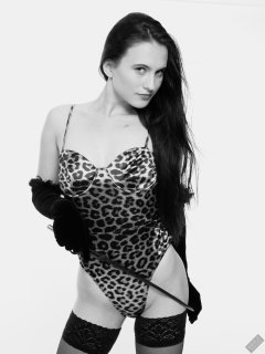 2019-12-14 Kristine Gold models her own high-leg animal print one-piece swimsuit