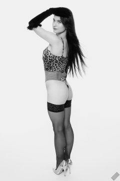 2019-12-14 Kristine Gold models her own high-leg animal print one-piece swimsuit