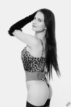 2019-12-14 Kristine Gold models her own high-leg animal print one-piece swimsuit