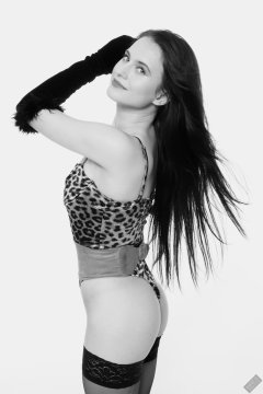 2019-12-14 Kristine Gold models her own high-leg animal print one-piece swimsuit