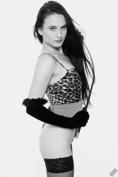 2019-12-14 Kristine Gold models her own high-leg animal print one-piece swimsuit