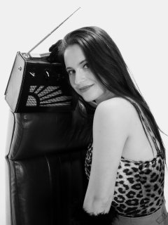 2019-12-14 Kristine Gold models her own high-leg animal print one-piece swimsuit