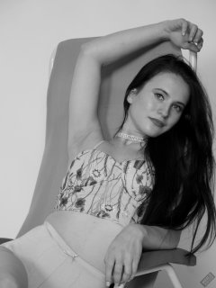 2019-12-14 Kristine Gold in retro beige top and panelled nylon-lycra pantie girdle relaxing on vintage British-made Relaxator 365 reclining chair relaxing on vintage British-made Relaxator 365 reclining chair.