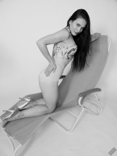 2019-12-14 Kristine Gold in retro beige top and panelled nylon-lycra pantie girdle relaxing on vintage British-made Relaxator 365 reclining chair relaxing on vintage British-made Relaxator 365 reclining chair.