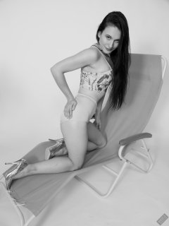 2019-12-14 Kristine Gold in retro beige top and panelled nylon-lycra pantie girdle relaxing on vintage British-made Relaxator 365 reclining chair relaxing on vintage British-made Relaxator 365 reclining chair.