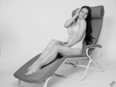 2019-12-14 Kristine Gold in retro beige top and panelled nylon-lycra pantie girdle relaxing on vintage British-made Relaxator 365 reclining chair relaxing on vintage British-made Relaxator 365 reclining chair.