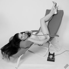 2019-12-14 Kristine Gold in retro beige top and panelled nylon-lycra pantie girdle relaxing on vintage British-made Relaxator 365 reclining chair relaxing on vintage British-made Relaxator 365 reclining chair.