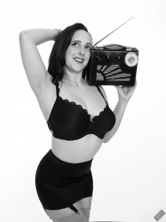 2020-01-04 Alex Allure in her own black bra and girdle, listening to vintage Roamer Ten radio