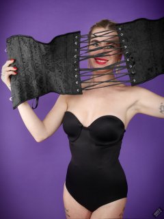 2020-01-18 Danni Moss in black one-piece Miraclesuit bodyshaper and tightly-laced underbust corset