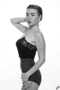 2020-01-18 Danni Moss in black strapless bra-top and purple high-waisted control-briefs