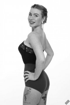 2020-01-18 Danni Moss in black strapless bra-top and purple high-waisted control-briefs