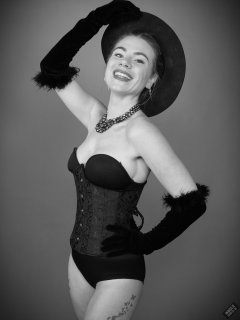 2020-01-18 Danni Moss in black one-piece Miraclesuit bodyshaper and tightly-laced underbust corset