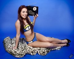 2020-02-02 Jessica Maria listens to vintage Radio Exchange Roamer Ten reciever. Jessica wears blue neoprene bikini