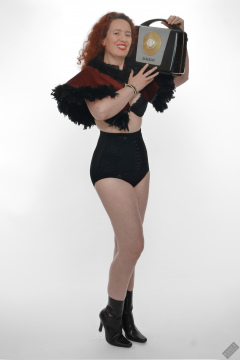 Chiara models tight, vintage-style, high-waisted, hook-front girdle for her 21st anniversary shoot