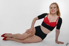 Rebecca Love - fitness set, in black posture top, red bra and lycra control briefs, worn as hotpants