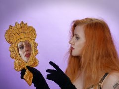 Rebecca Love - poses with hand-held mirror