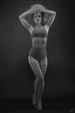 Rebecca Love - in her own red net bodystocking, worn over matching red bra and girdle