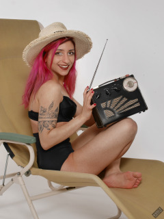 2022-07-02 Mave D models black bra top and vintage girdle worn as hotpants, whilst relaxing in vintage Relaxator 365 chair and listening to Roamer Ten radio