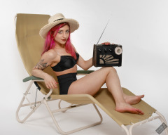 2022-07-02 Mave D models black bra top and vintage girdle worn as hotpants, whilst relaxing in vintage Relaxator 365 chair and listening to Roamer Ten radio