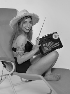 2022-07-02 Mave D models black bra top and vintage girdle worn as hotpants, whilst relaxing in vintage Relaxator 365 chair and listening to Roamer Ten radio