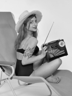 2022-07-02 Mave D models black bra top and vintage girdle worn as hotpants, whilst relaxing in vintage Relaxator 365 chair and listening to Roamer Ten radio