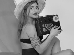 2022-07-02 Mave D models black bra top and vintage girdle worn as hotpants, whilst relaxing in vintage Relaxator 365 chair and listening to Roamer Ten radio