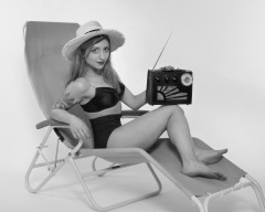 2022-07-02 Mave D models black bra top and vintage girdle worn as hotpants, whilst relaxing in vintage Relaxator 365 chair and listening to Roamer Ten radio