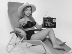 2022-07-02 Mave D models black bra top and vintage girdle worn as hotpants, whilst relaxing in vintage Relaxator 365 chair and listening to Roamer Ten radio