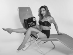 2022-07-02 Mave D models black bra top and vintage girdle worn as hotpants, whilst relaxing in vintage Relaxator 365 chair and listening to Roamer Ten radio