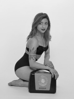 2022-07-02 Mave D modelling black bra top and vintage girdle worn as hotpants, with Ferguson Bakelite radio
