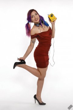 Mave D in her own red velvet dress, listening to vintage Sony Walkman