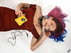 Mave D in her own red velvet dress, listening to vintage Sony Walkman