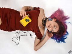 Mave D in her own red velvet dress, listening to vintage Sony Walkman