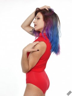 Mave D in matching red top and red control briefs worn as hotpants