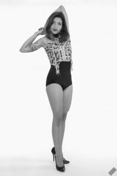 Mave D moselling her own suspender top c/w black high-waist gardle worn as hotpants