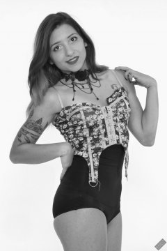 Mave D moselling her own suspender top c/w black high-waist gardle worn as hotpants