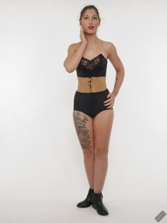 Michelle's Modelling in black strapless bra-top and matching black high-waist girdle, worn as hotpants, c/w tight leather corset-belt